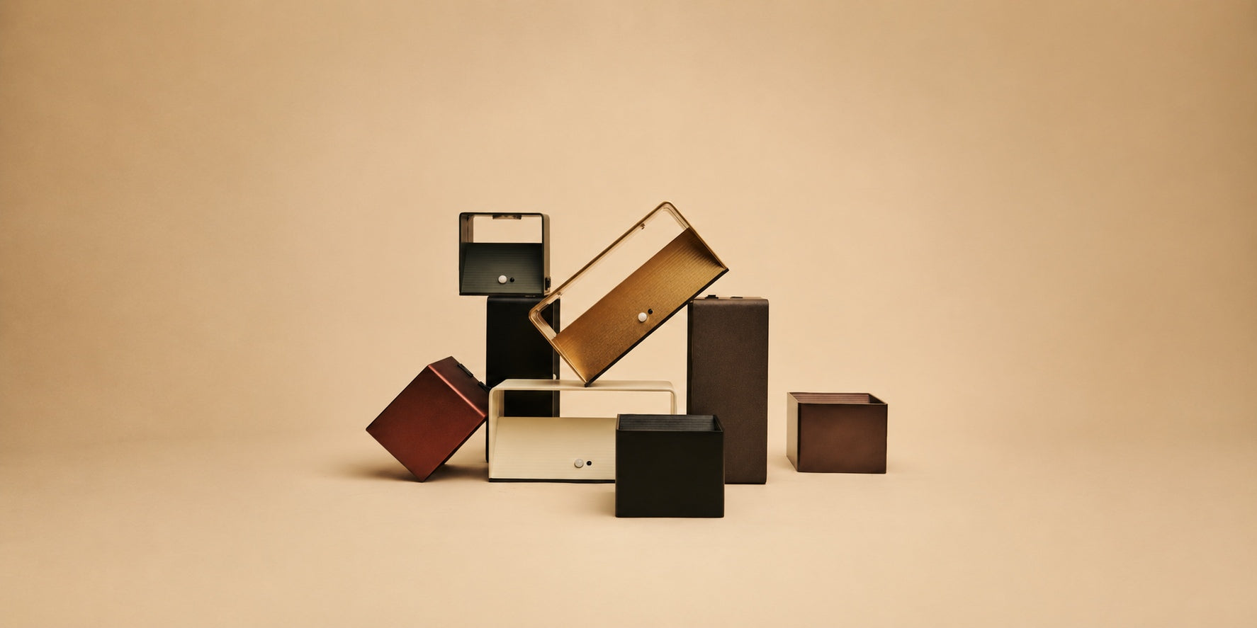 Tavellio Tess and Tessa wall lamps in stacked colorful boxy shapes, arranged as a sculptural display.