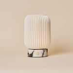 Alba cordless table lamp with Calacatta Vionaro marble base on a beige studio backdrop
