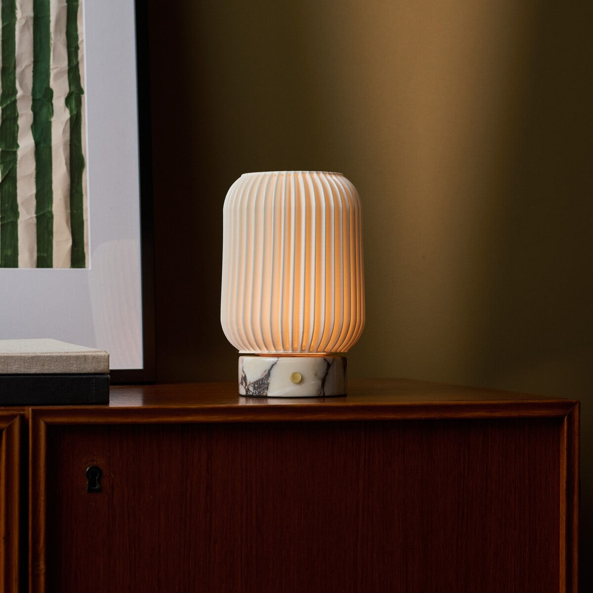 Alba cordless table lamp with dramatic Calacatta Vionaro veining on a walnut sideboard
