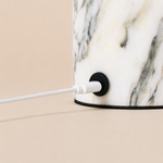 USB-C charging port built into the Arabescato marble base of the Dou cordless table lamp