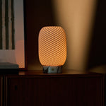 Tavellio Aurora rechargeable table lamp in Calacatta Vionaro marble and porcelain on a beige backdrop