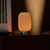 Tavellio Aurora rechargeable table lamp in Calacatta Vionaro marble and porcelain on a beige backdrop