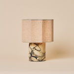 Tavellio Bonnard rechargeable table lamp with yellow Calacatta Vionaro marble base on a neutral studio backdrop
