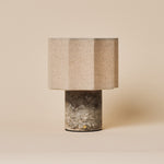 Bonnard rechargeable table lamp with a Silver Travertine stone base and linen shade on a plain backdrop
