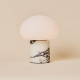 Codde cordless table lamp with dome shade and Calacatta Vionaro marble base on a neutral background