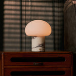 Codde rechargeable table lamp with Calacatta Vionaro marble base illuminated beside window blinds