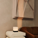 Close-up of Yce Black Cordless Wooden Lamp, highlighting frosted glass and warm glow.