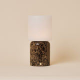 Cordless table lamp Cuyp Large in Emperador dark marble with a square frosted glass shade on a beige backdrop