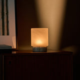 Tavellio Cuyp Small rechargeable table lamp close-up showing its frosted shade and travertine base
