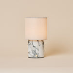 Tavellio Dou rechargeable table lamp in Arabescato marble with a natural linen drum shade