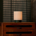 Cordless table lamp Dou Small with Verde Alpi green marble base on a vintage wooden dresser