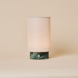 Floris cordless table lamp in Ice Green marble with linen drum shade on a neutral studio background