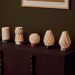Textured porcelain lampshade collection for Tavellio rechargeable table lamps, displayed on a wooden sideboard