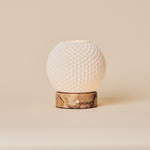 Cordless table lamp showing the dimpled porcelain shade and pink marble base on a plain background