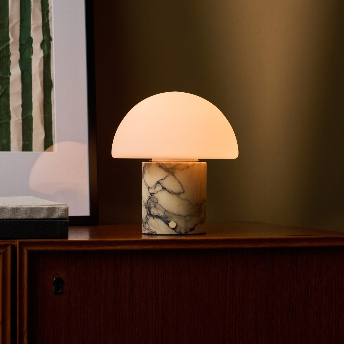 Cordless table lamp featuring dramatic dark veining in a warm gold marble lamp base