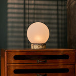 Rechargeable table lamp Metsu Small Calacatta Vionaro yellow marble on a bedroom dresser