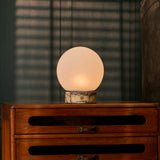 Rechargeable table lamp Metsu Small Calacatta Vionaro yellow marble on a bedroom dresser