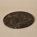 Round Emperador Dark decorative tray with rich brown veining on a soft neutral backdrop