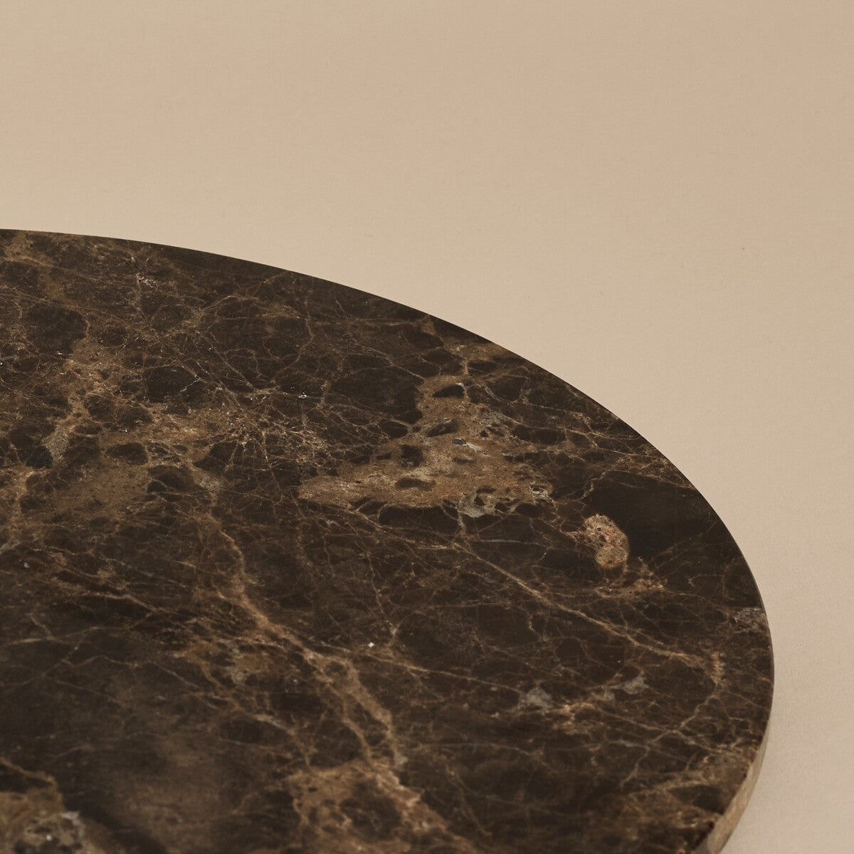Close-up of Emperador Dark marble tray edge highlighting deep brown veining and texture
