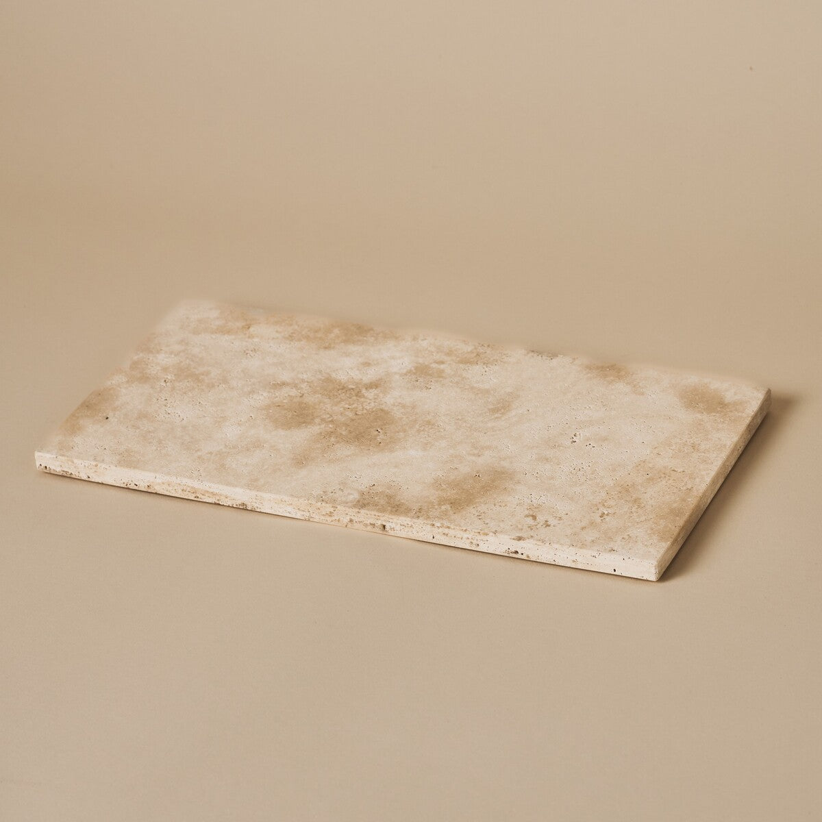 Nori medium Classic Travertine tray in warm beige travertine stone on a neutral studio background