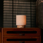 Rechargeable table lamp Onoda Small pink Calacatta marble base with linen shade on bedroom nightstand