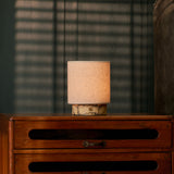 Cordless table lamp Onoda Small Calacatta Vionaro yellow marble base on beige studio background
