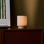 Cordless table lamp Onoda Small Calacatta Vionaro yellow marble base on dark wood cabinet