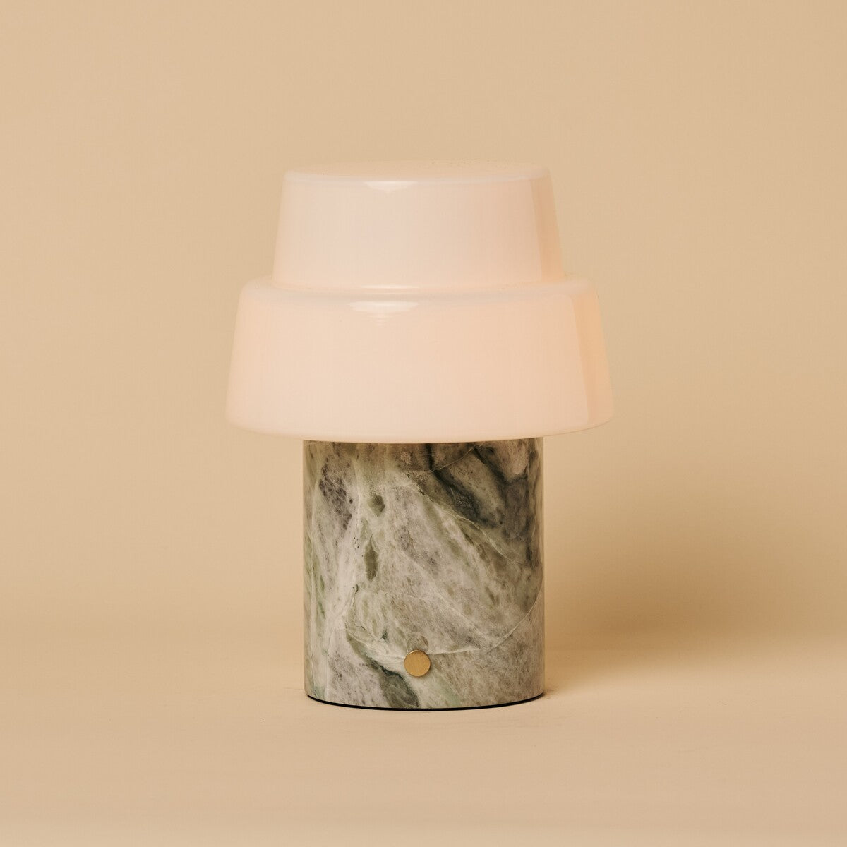 Pissarro rechargeable table lamp in ice green marble, shown on a neutral studio background.