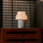 Rechargeable table lamp Pissarro Medium Blue Calcite marble base glowing on nightstand