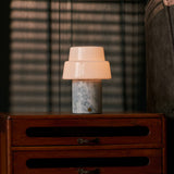 Rechargeable table lamp Pissarro Medium Blue Calcite marble base glowing on nightstand