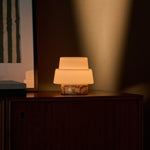 Cordless table lamp Pissarro Small Calacatta Vionaro Yellow marble base on dark wood dresser