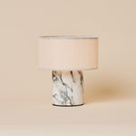 Redon rechargeable table lamp featuring an arabescato white marble base and linen drum shade