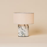 Redon rechargeable table lamp featuring an arabescato white marble base and linen drum shade
