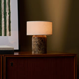 Cordless table lamp Redon Large Emperador Dark marble base beside green wall art on sideboard