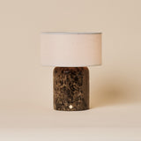 Redon cordless table lamp with dark Emperador marble base and beige linen drum shade