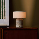 Redon rechargeable table lamp with silver-grey travertine base and beige linen shade