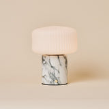 Renoir Medium rechargeable table lamp in arabescato marble with ribbed glass shade, studio shot