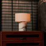 Rechargeable Redon table lamp in Calacatta white marble with linen shade on a wooden dresser