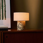Rechargeable table lamp Redon, Calacatta Vionaro yellow marble base with linen drum shade on sideboard