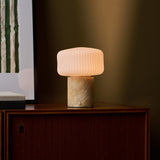 Renoir Medium cordless table lamp with honey onyx marble base and glowing ribbed glass shade