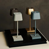 Combi Set Professional – 4 x Sarphati Mini Mocha Brown Rechargeable Table Lamps & 1 x Amstel Wireless Charging Station with Qi-Technology Tavellio