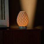 Rechargeable table lamp Serena Arabescato marble, illuminated porcelain shade beside framed art