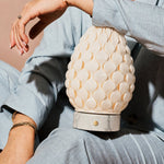 Rechargeable table lamp Serena Bianco Statuarietto marble, textured porcelain shade held in hand