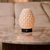 Cordless Serena black wood table lamp with ribbed porcelain shade on a marble console