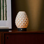 Rechargeable Serena black wood table lamp with scalloped porcelain shade on a sideboard