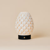 Rechargeable table lamp Serena Black wooden base, ribbed porcelain shade on beige studio background