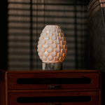 Serena rechargeable table lamp with Calacatta Viola marble base on a dark wood dresser