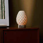 Serena rechargeable table lamp with Calacatta Viola marble base on a wooden sideboard