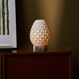 Serena rechargeable table lamp with Calacatta Viola marble base on a wooden sideboard