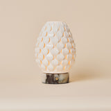 Serena cordless table lamp with white porcelain scalloped shade and Calacatta Viola marble base
